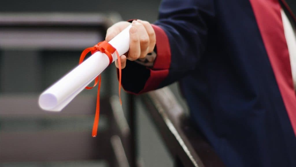 Person Holding White Scroll