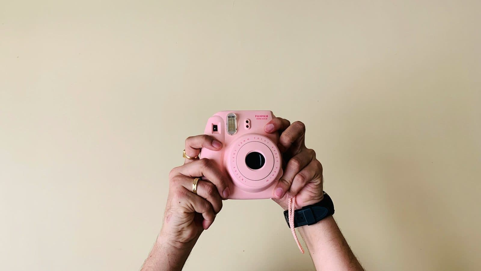 person holding pin camera